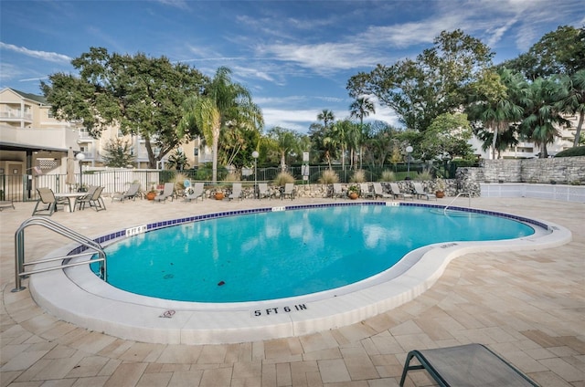 view of swimming pool with a patio