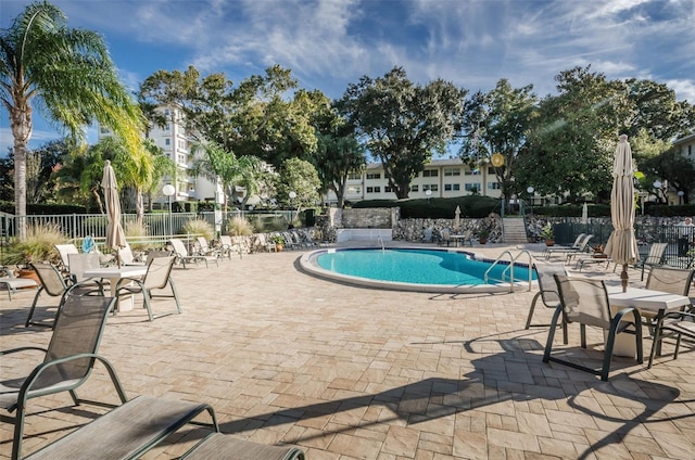 view of swimming pool featuring a patio