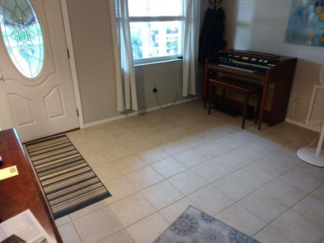 entrance foyer with light tile patterned flooring