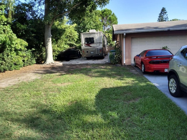 view of yard with a garage