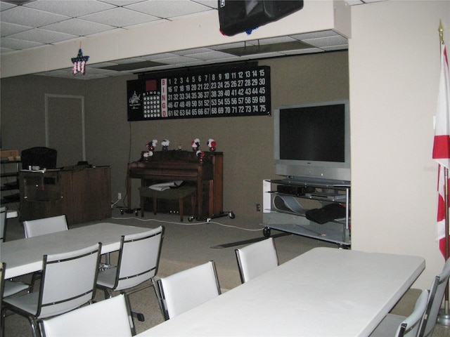 dining area featuring a paneled ceiling