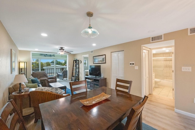 dining space featuring ceiling fan and light hardwood / wood-style flooring