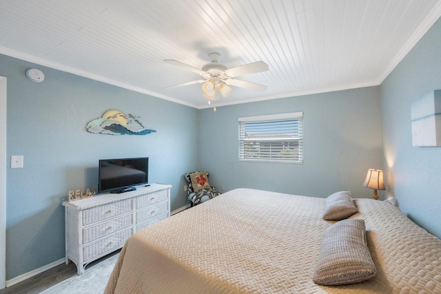 bedroom with ornamental molding, ceiling fan, and hardwood / wood-style flooring