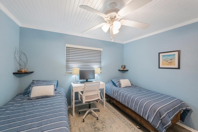 bedroom with ornamental molding and ceiling fan