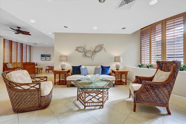 tiled living room featuring ceiling fan