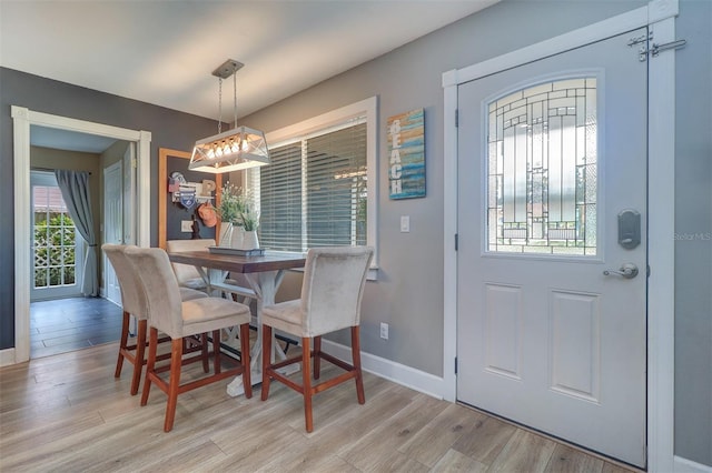 dining area with light hardwood / wood-style floors