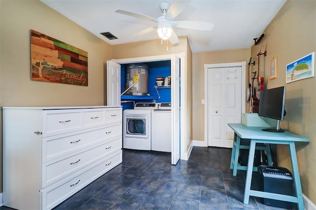 kitchen featuring water heater, dark tile patterned floors, washer and dryer, white cabinetry, and ceiling fan