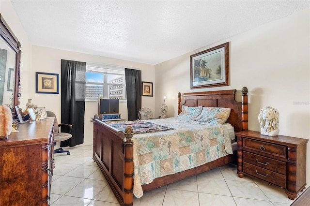 3128 59th St S Unit 214, Gulfport, FL 33707 - bedroom featuring an office area, light tile patterned flooring, and a textured ceiling