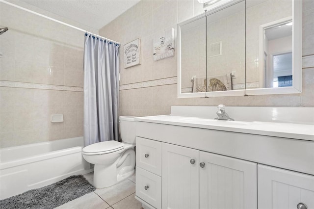 3128 59th St S Unit 214, Gulfport, FL 33707 - bathroom with vanity, tile walls, shower / bathtub combination with curtain, toilet, and tile patterned flooring
