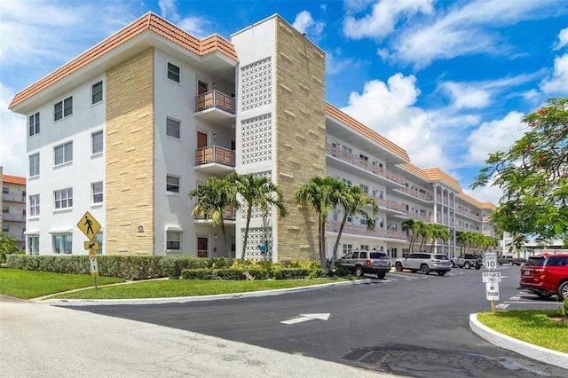 3128 59th St S Unit 214, Gulfport, FL 33707 - view of building exterior with uncovered parking