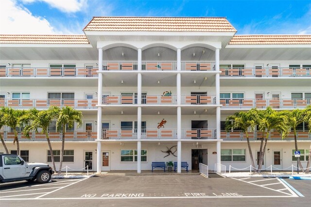 3128 59th St S Unit 214, Gulfport, FL 33707 - view of apartment building / complex featuring uncovered parking