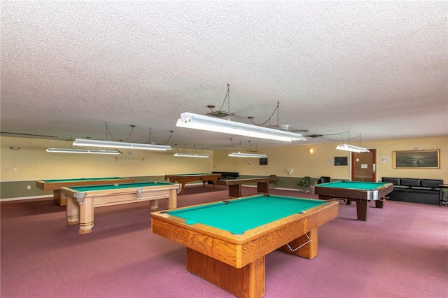 recreation room with carpet, a textured ceiling, and pool table