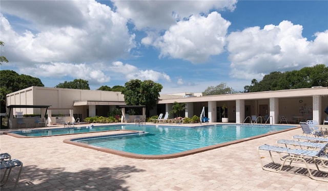 view of swimming pool with a patio area