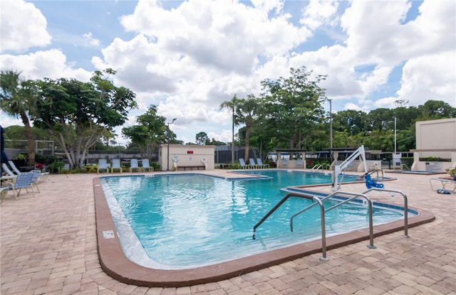 view of swimming pool with a patio