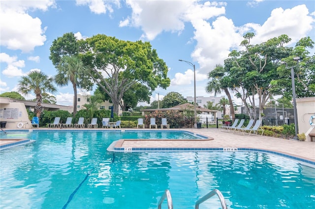 view of swimming pool with a patio area