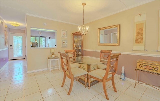 tiled dining room featuring crown molding and a chandelier