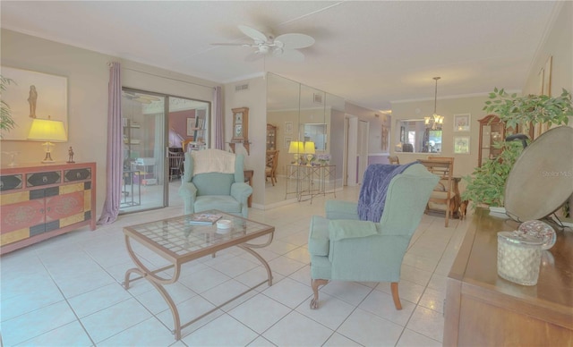 living room with ceiling fan with notable chandelier, ornamental molding, and light tile patterned flooring