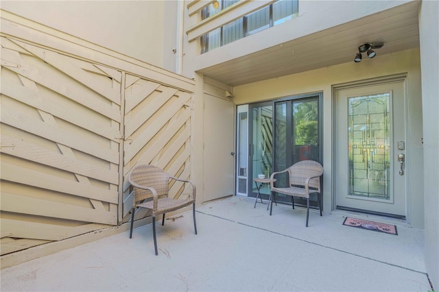 entrance to property with a patio