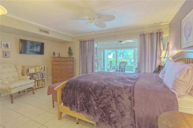 bedroom featuring ceiling fan, crown molding, light tile patterned floors, and a textured ceiling