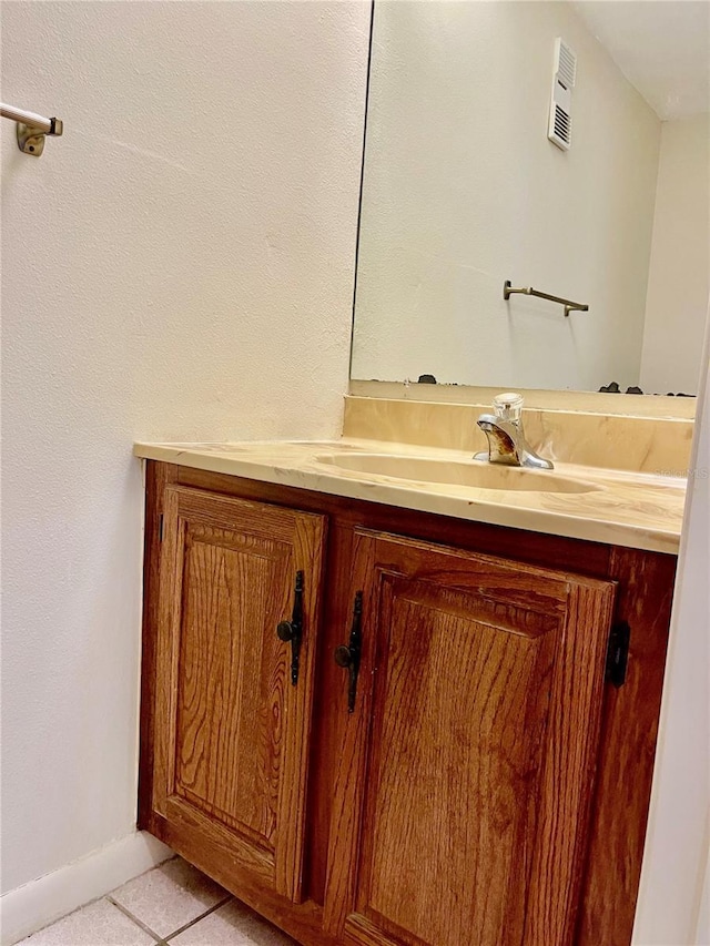 bathroom featuring tile patterned floors and vanity