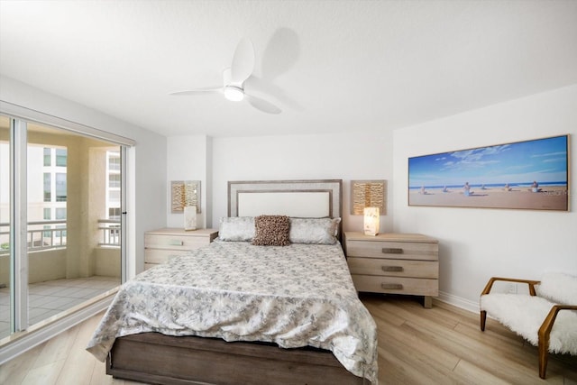 bedroom featuring light wood-style floors, baseboards, and a ceiling fan