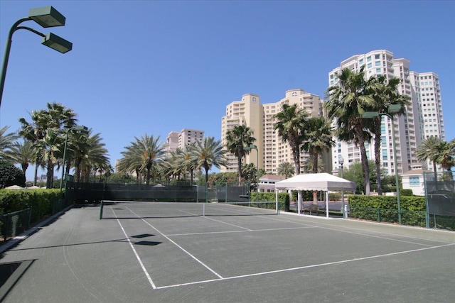 view of tennis court with fence