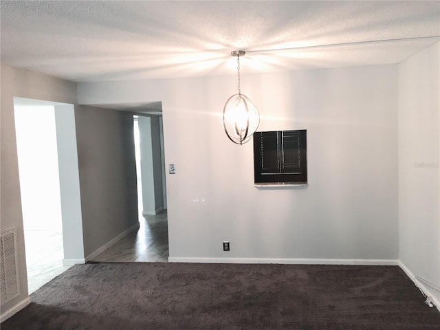 333 Lake Howard Dr NW Unit 204C, Winter Haven, FL 33880 - spare room with carpet, baseboards, and a textured ceiling