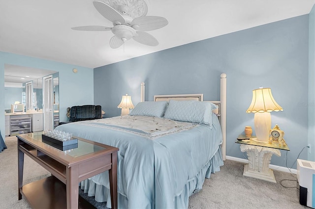 bedroom with light carpet and ceiling fan