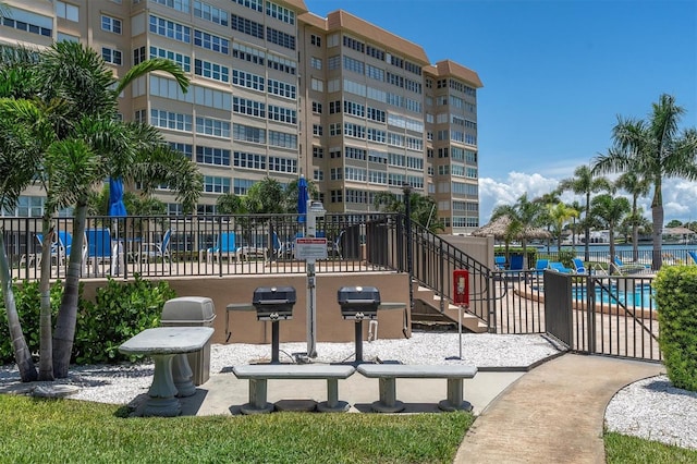 view of building exterior with a community pool