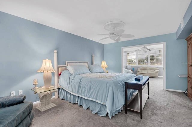 carpeted bedroom featuring ceiling fan
