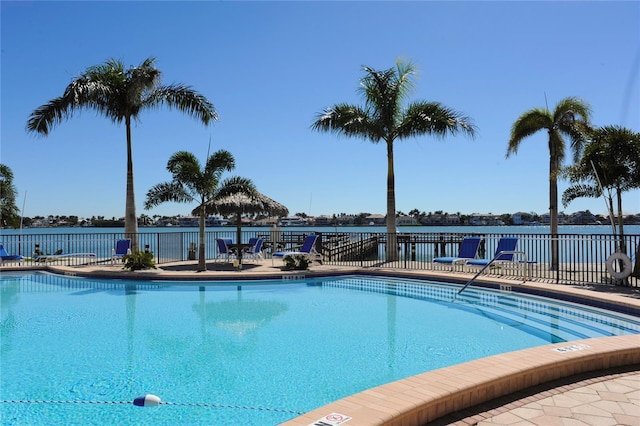 view of pool with a water view