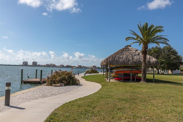 view of dock featuring a yard, a gazebo, and a water view