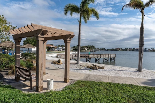 view of dock with a water view and a pergola