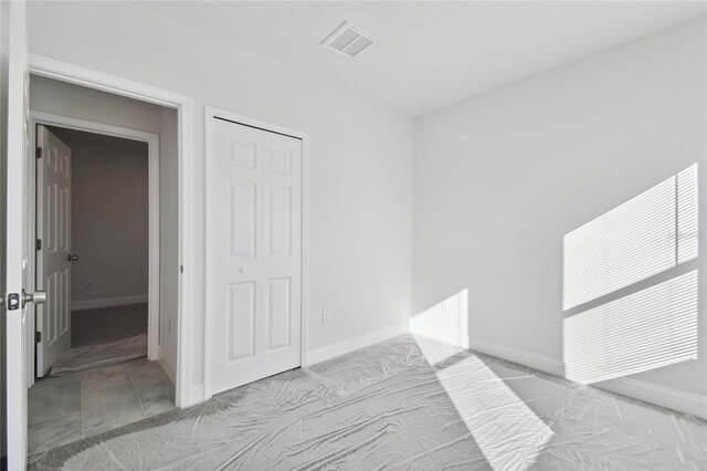 unfurnished bedroom featuring a closet