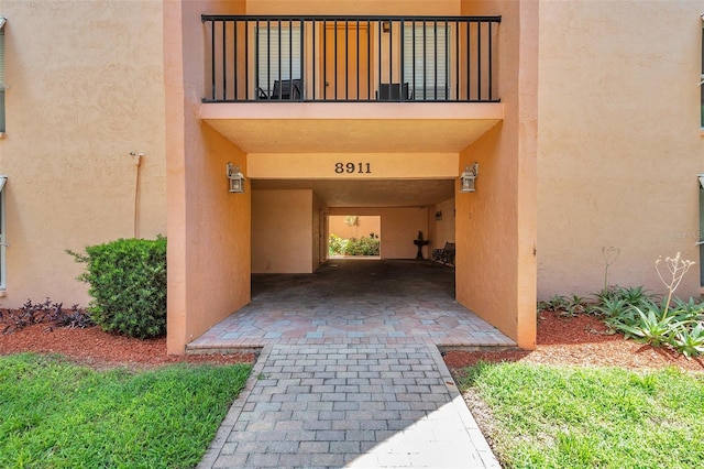 doorway to property featuring a balcony