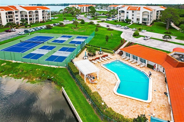 view of pool featuring a water view