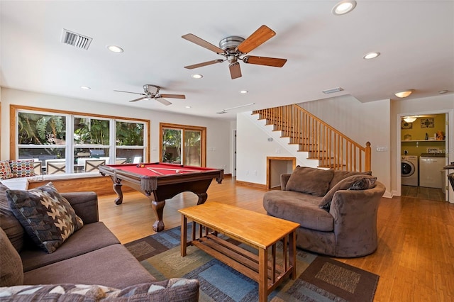 recreation room featuring hardwood / wood-style floors, separate washer and dryer, ceiling fan, and billiards