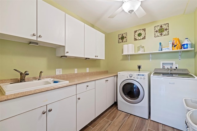 washroom featuring washer and clothes dryer, ceiling fan, cabinets, and sink