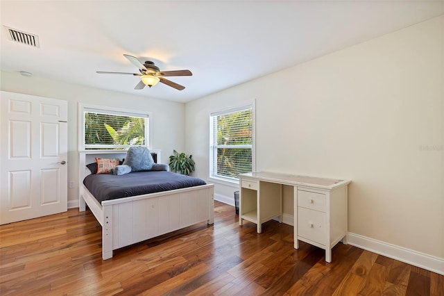 bedroom featuring dark hardwood / wood-style floors and ceiling fan