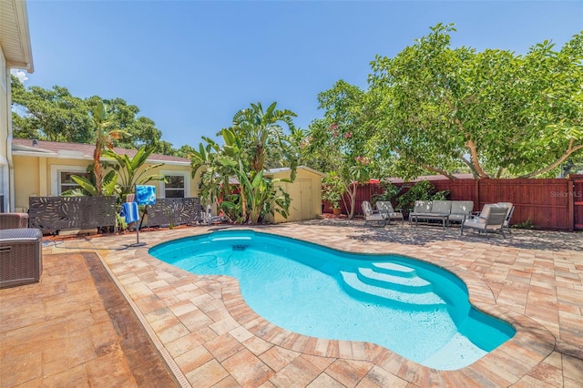 view of swimming pool featuring outdoor lounge area and a patio