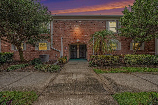 view of front of home featuring central AC unit