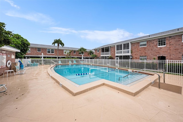 view of swimming pool with a patio area