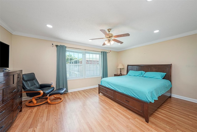 bedroom with ceiling fan, light hardwood / wood-style floors, and crown molding