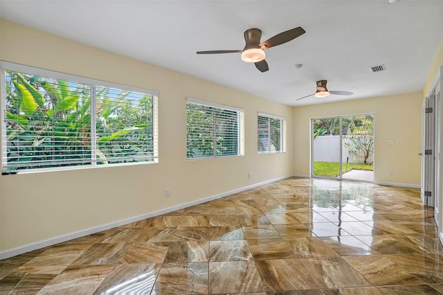 unfurnished room featuring ceiling fan