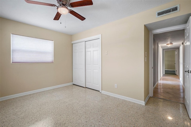 unfurnished bedroom with a closet and ceiling fan