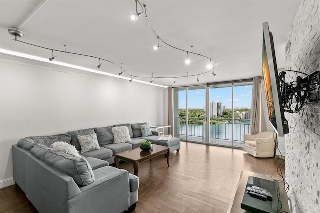 living room featuring parquet flooring and expansive windows