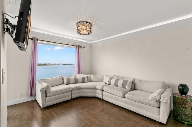 living room with dark parquet flooring and ornamental molding