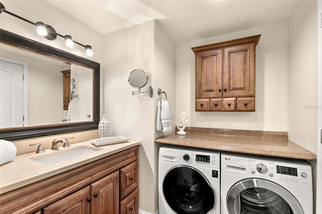 laundry area featuring separate washer and dryer and sink