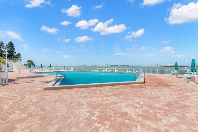 view of swimming pool featuring a patio area