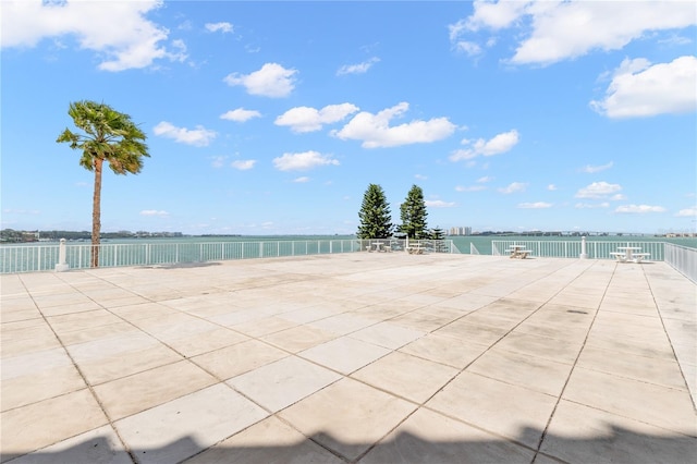 view of patio featuring a water view